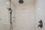 Primary shower with rainfall and handheld options 